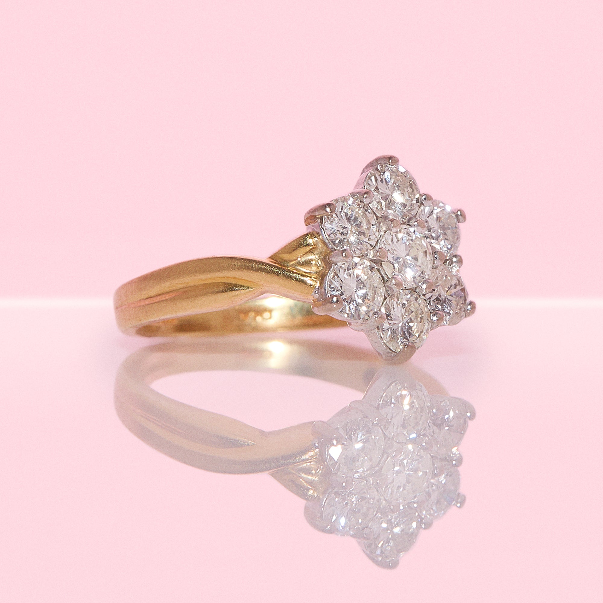 18ct gold diamond flower ring with a twisted band