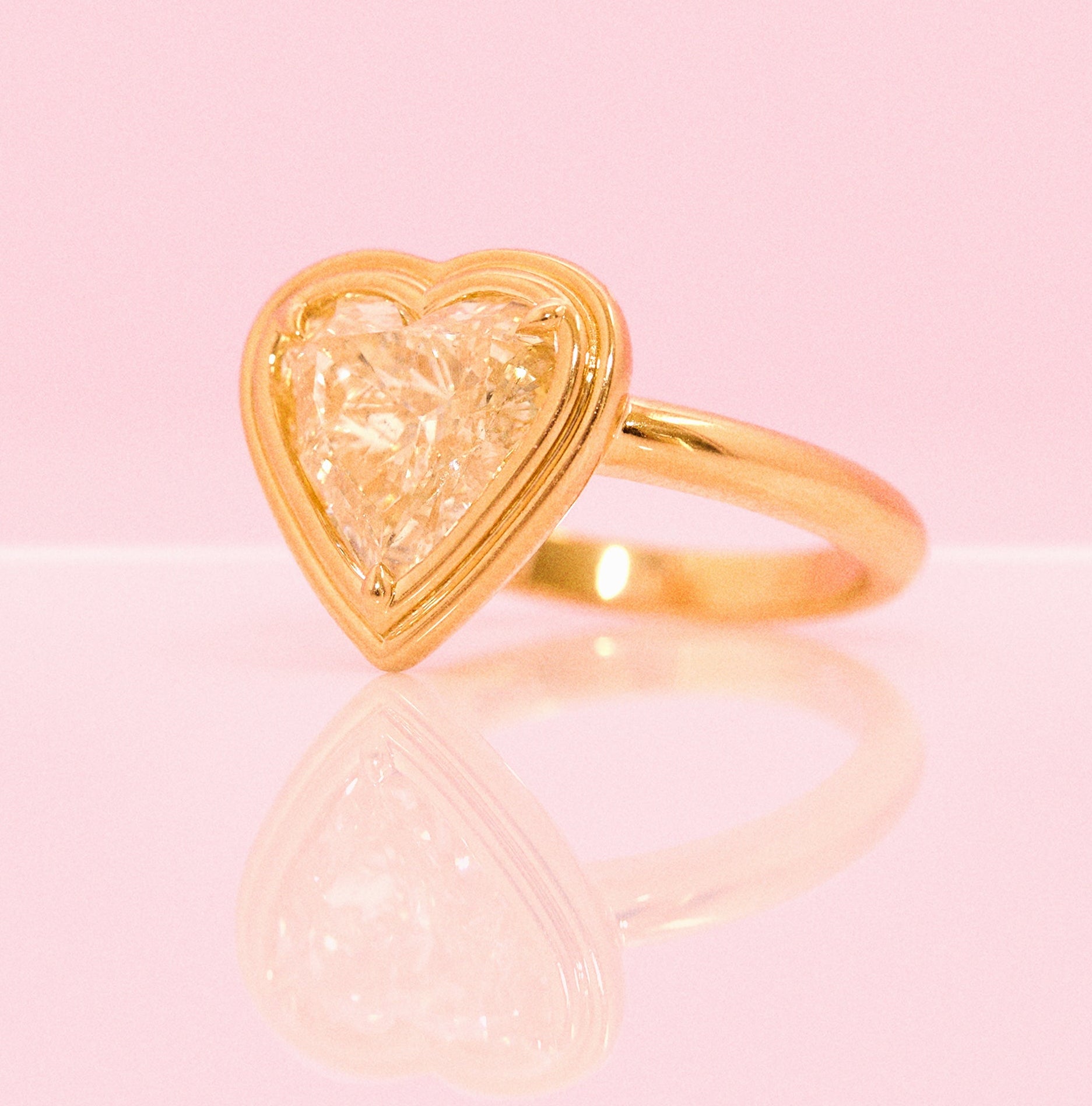 18ct gold bezel set fancy yellow 2.35ct heart-shaped diamond ring