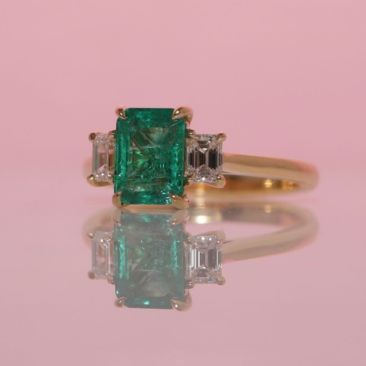 18ct gold 1.34ct emerald cut emerald and diamond three stone ring (made to order)