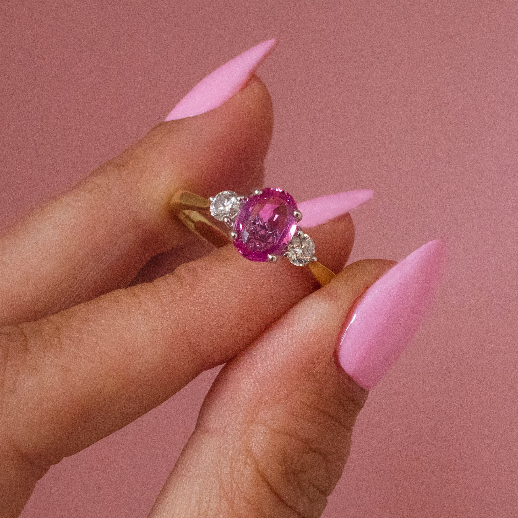 18ct gold 1.22ct pink sapphire and 0.25ct diamond three stone ring