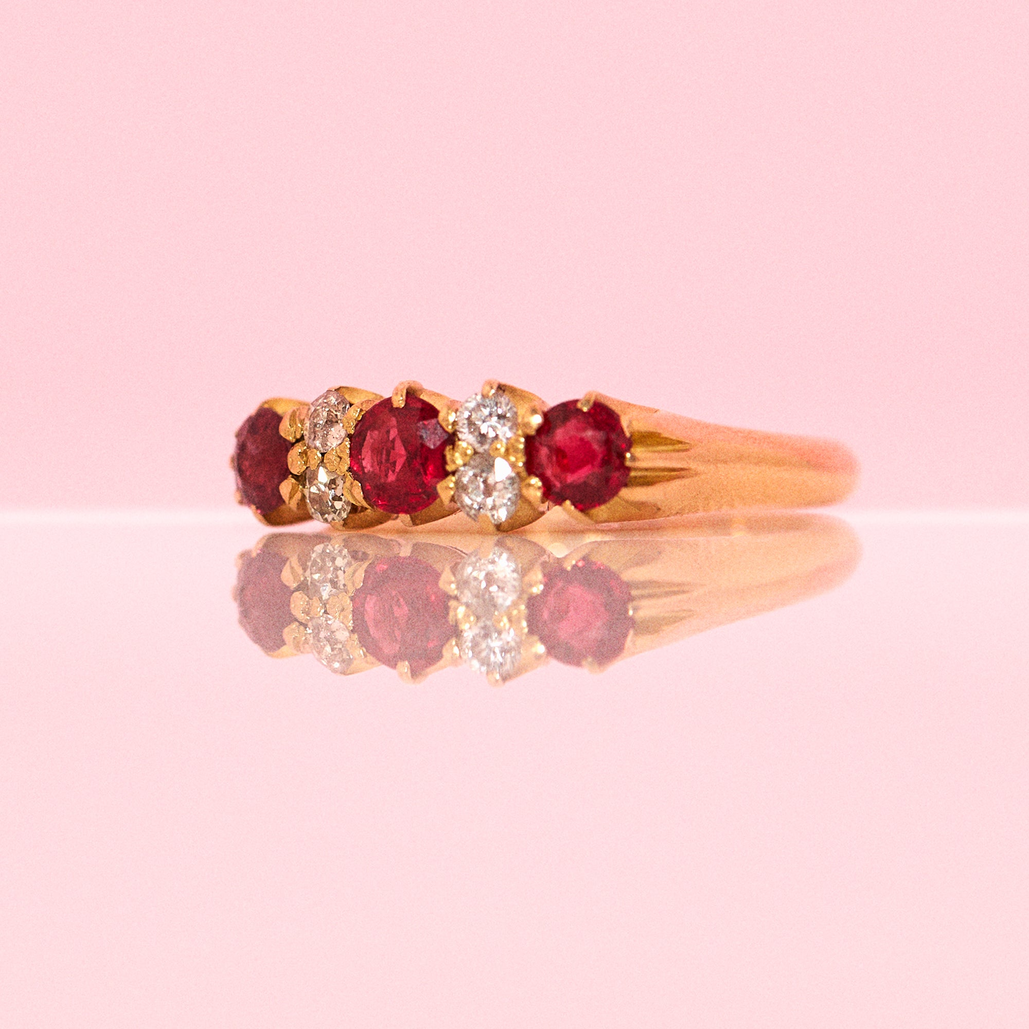 18ct gold ruby and diamond seven stone ring