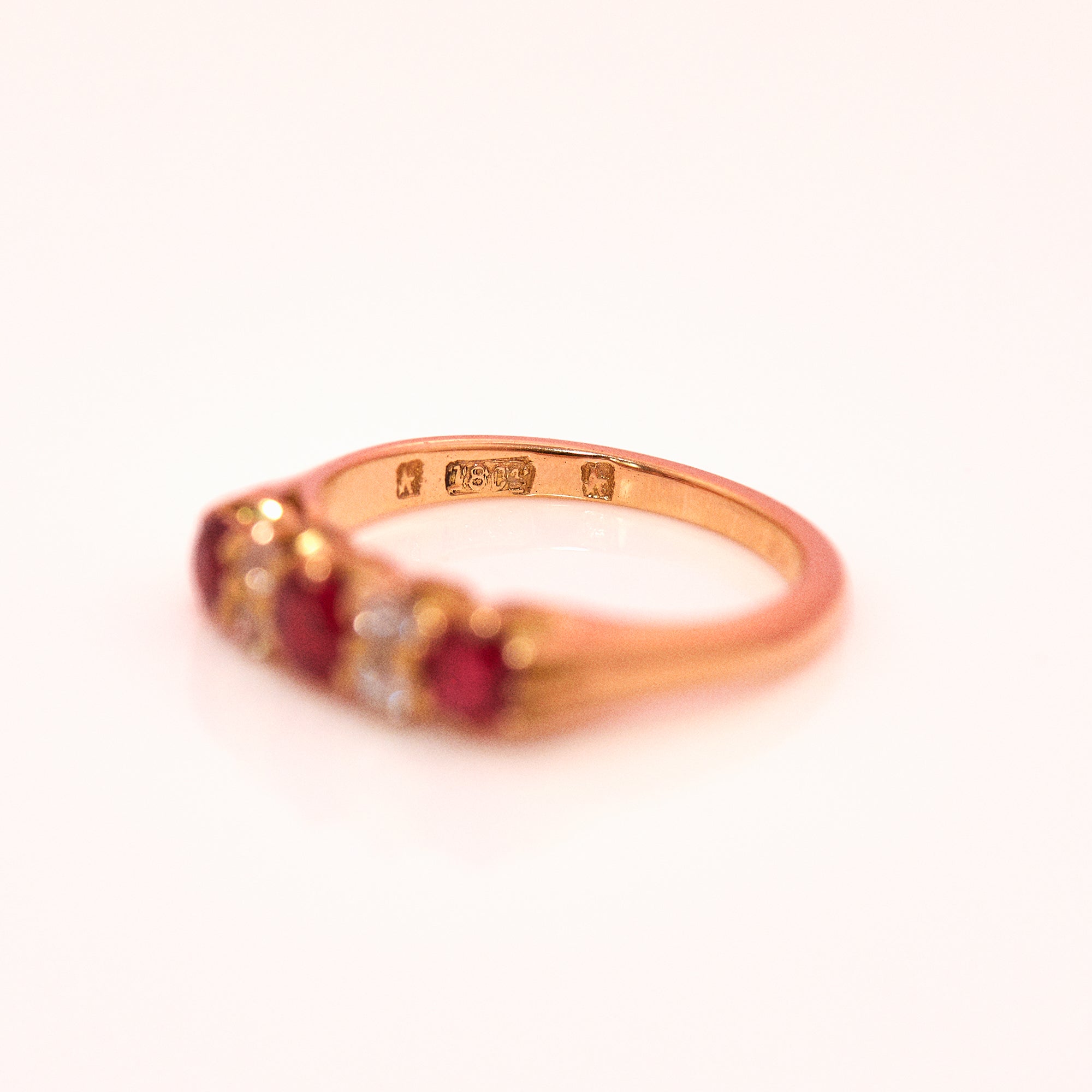 18ct gold ruby and diamond seven stone ring