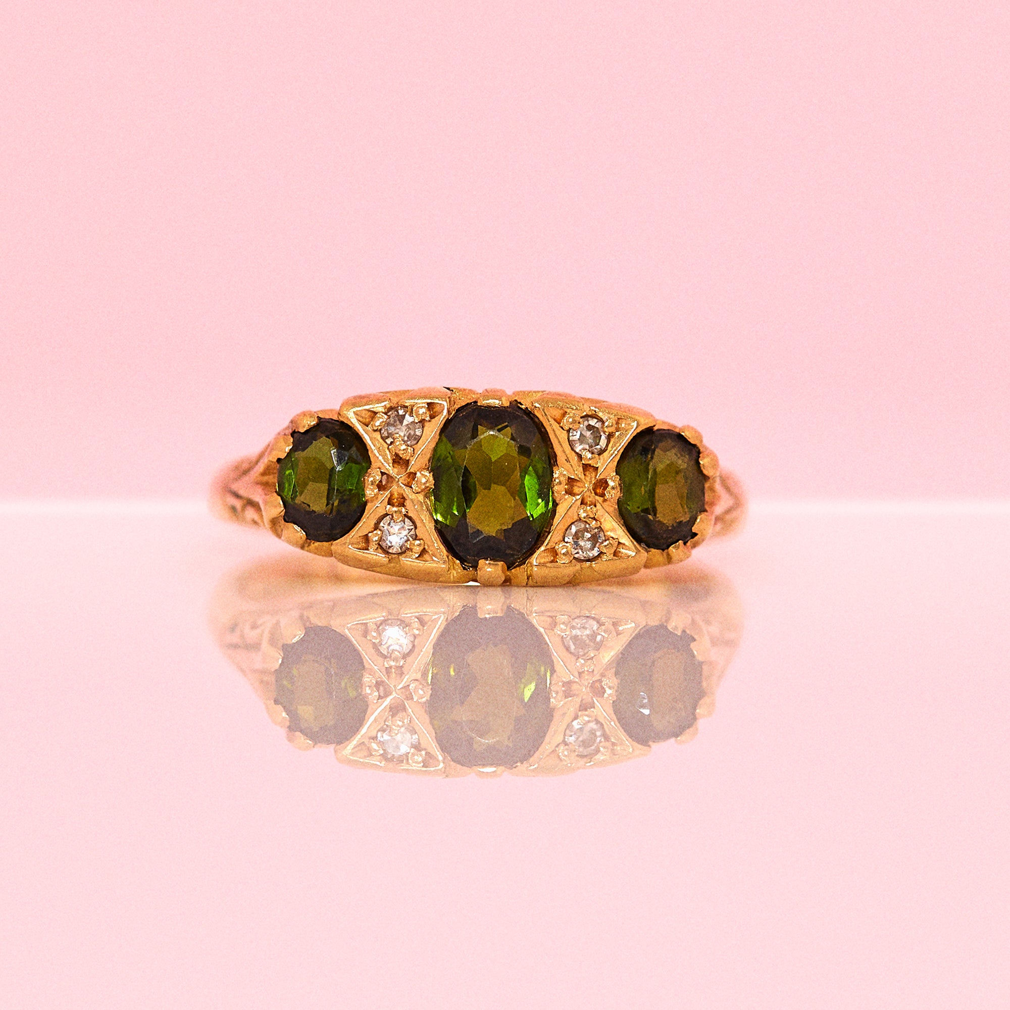 18ct gold ring set with green tourmaline and diamonds