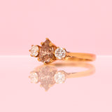 18ct gold three stone ring with a 1.10ct pear shaped yellow diamond centre stone