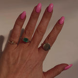 Platinum emerald and diamond three stone ring