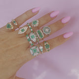 Platinum emerald and diamond flower ring