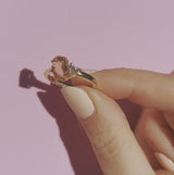 18ct gold ring set with a peach topaz and a heart shaped diamond