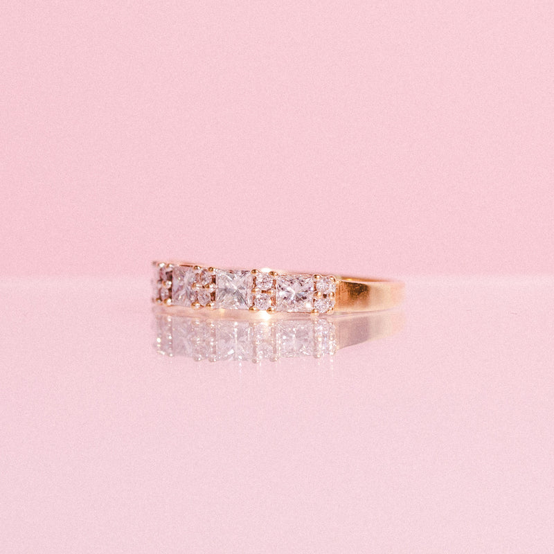 18ct gold half eternity ring with princess cut diamonds