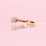 18ct yellow gold ring set with one diamond