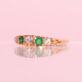 18ct gold ring set with emeralds and diamonds