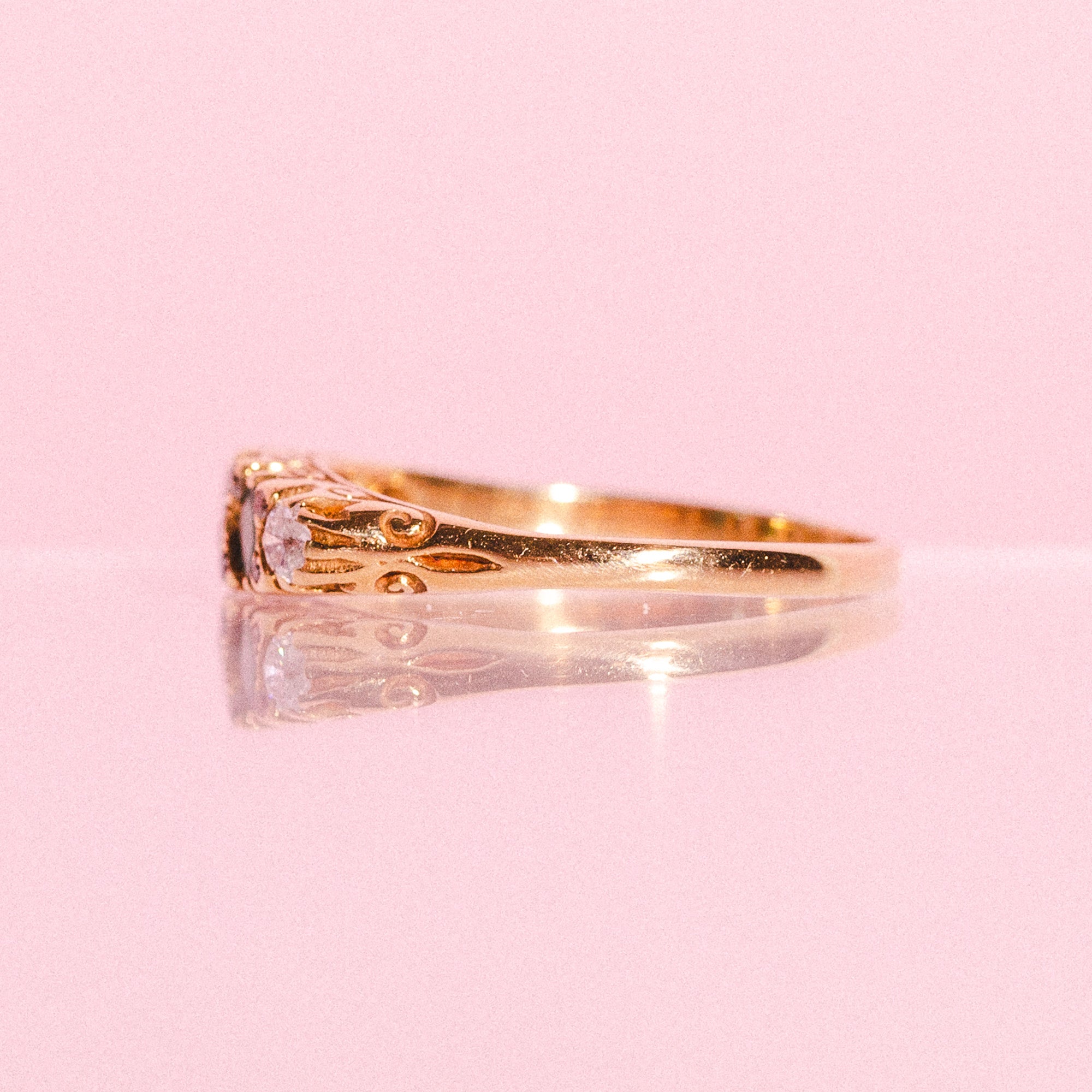 18ct gold ring set with emeralds and diamonds