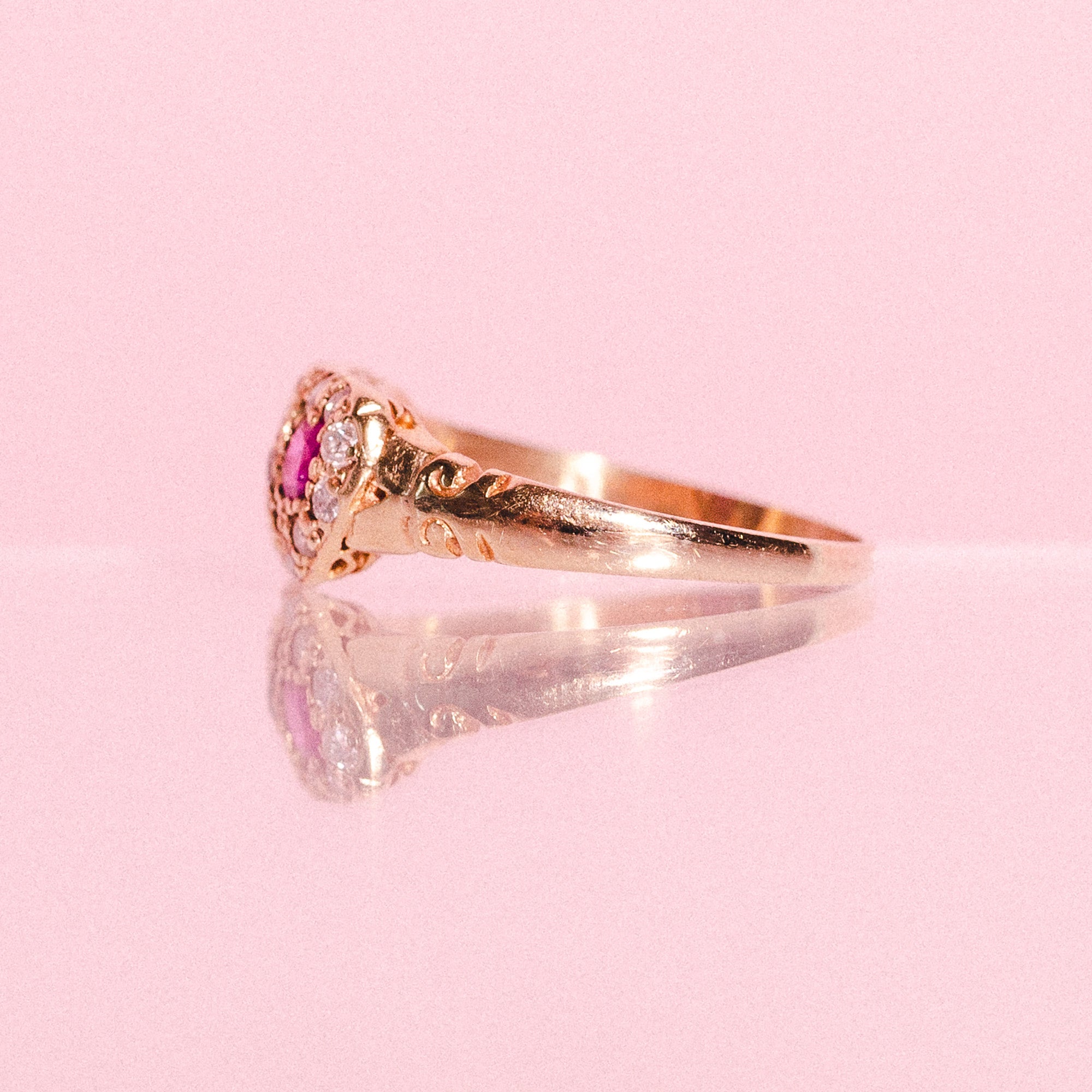 18ct gold love ring set with a ruby, a sapphire and diamonds