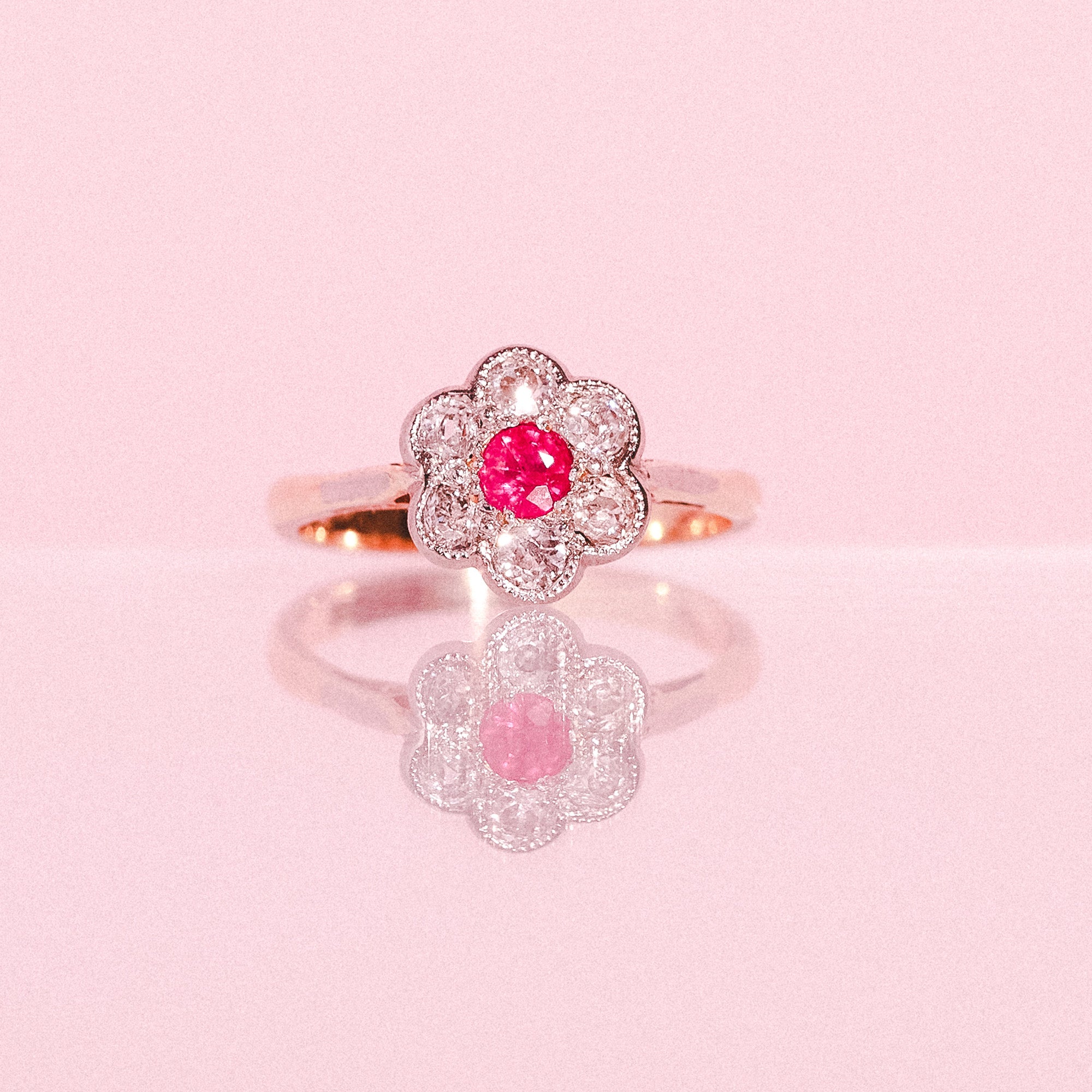 18ct gold ruby and diamond flower ring