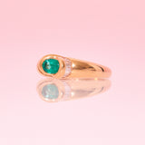 18ct gold ring set with a Colombian emerald and diamonds