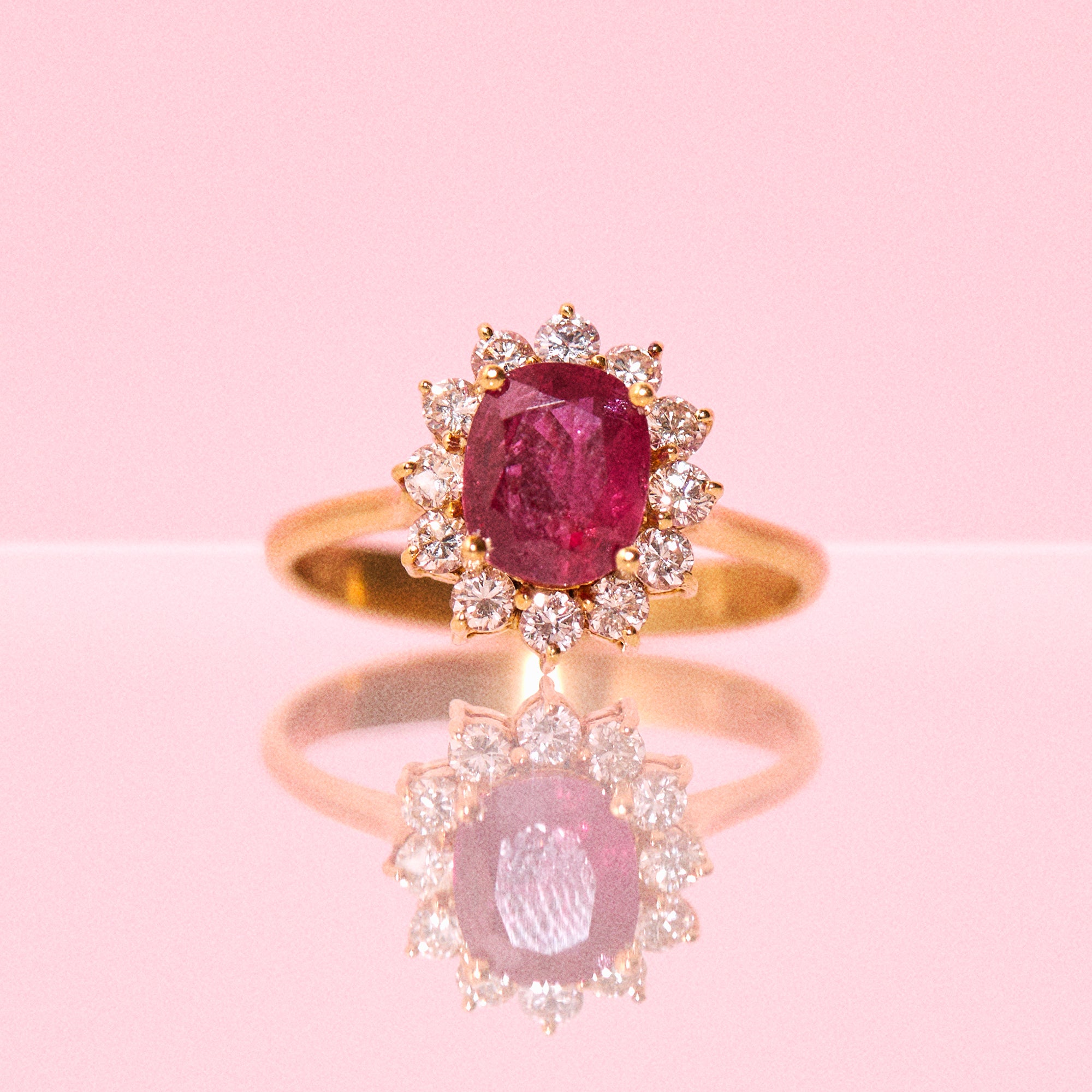 18ct gold ruby ring with a diamond cluster