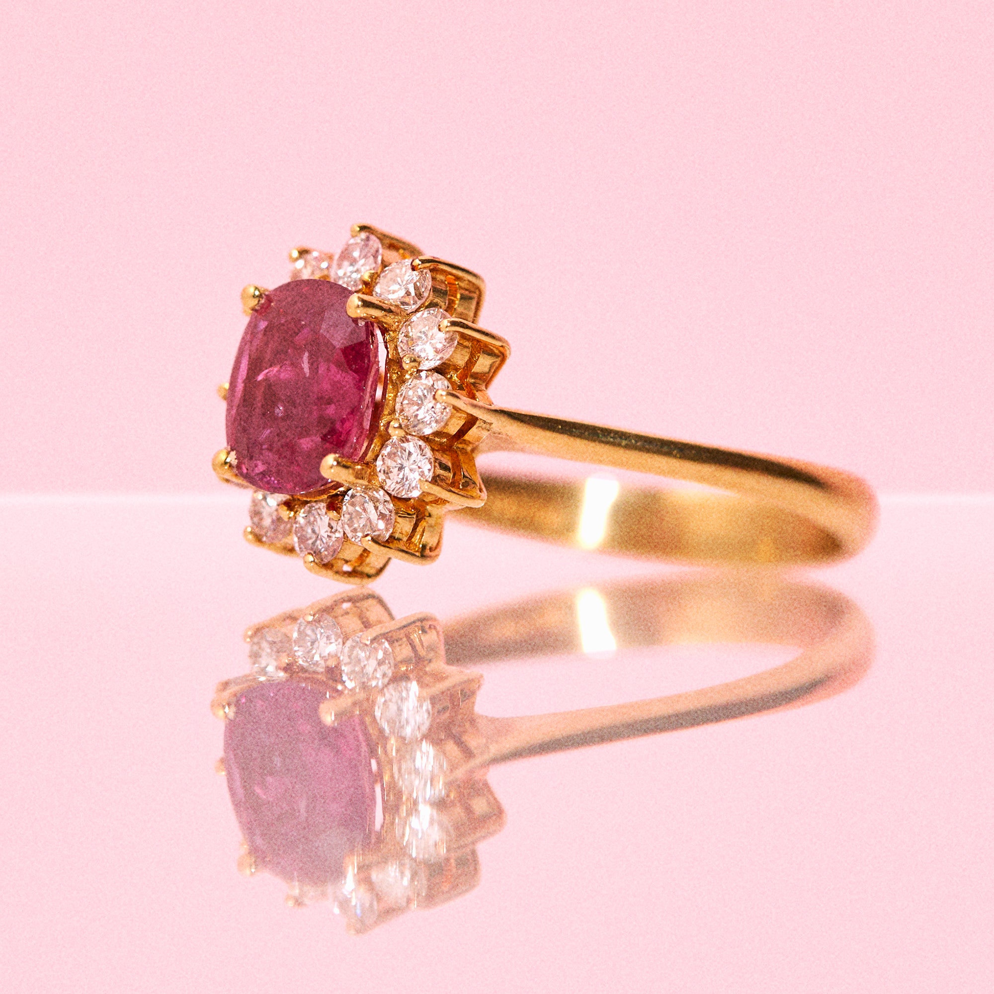 18ct gold ruby ring with a diamond cluster