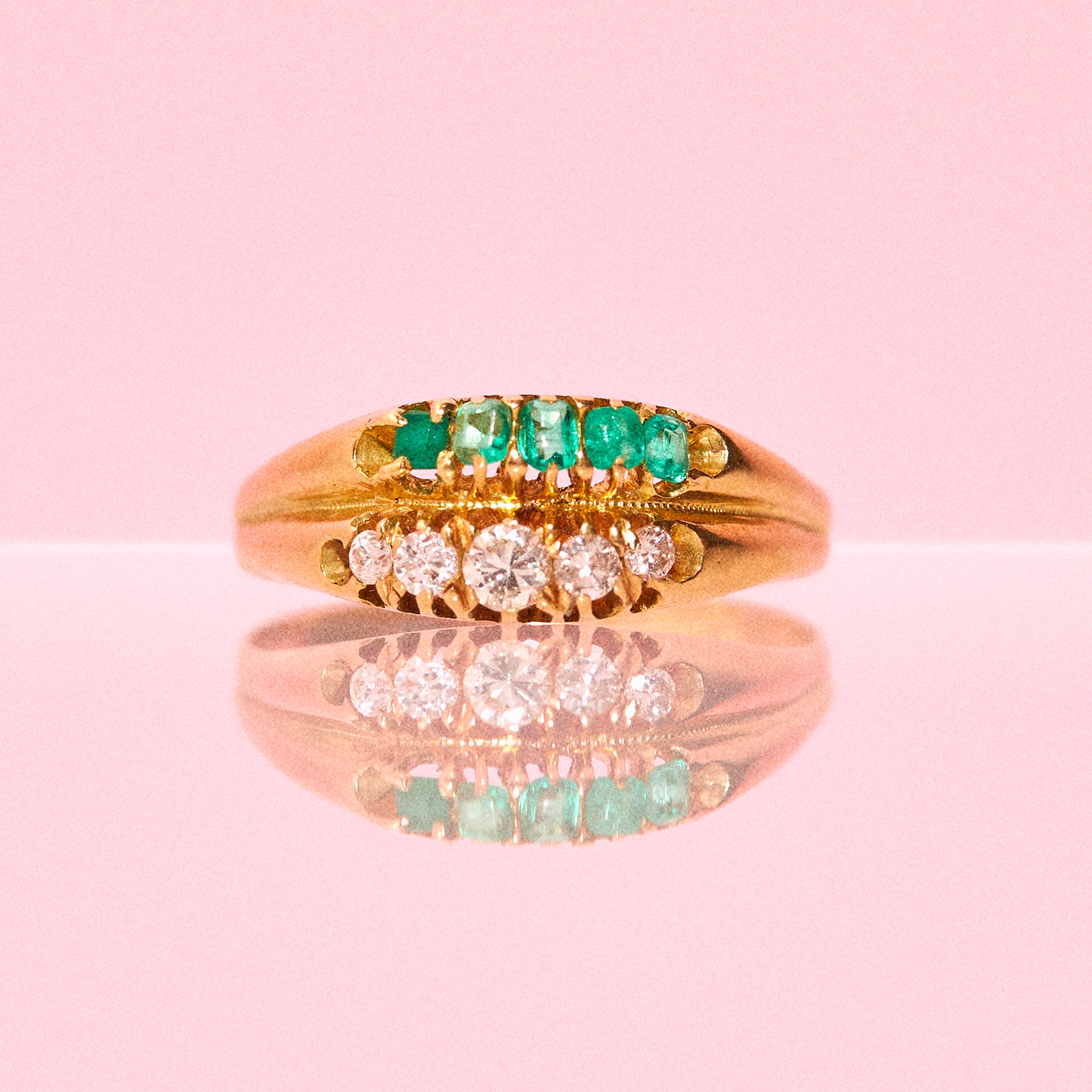 18ct gold ring set with emeralds and diamonds