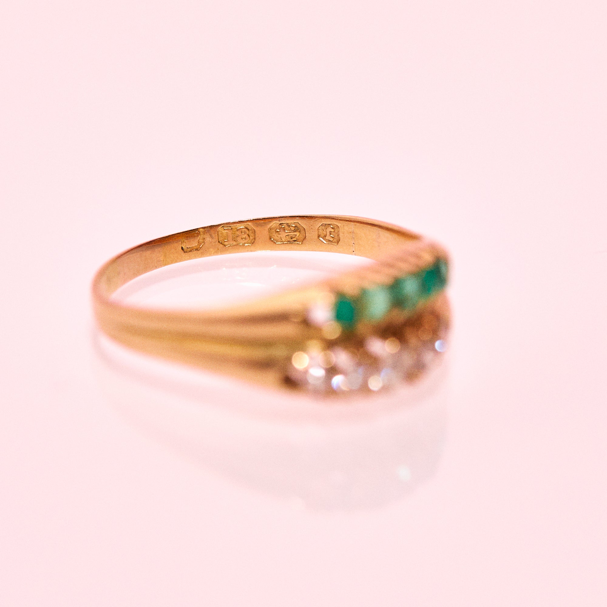 18ct gold ring set with emeralds and diamonds