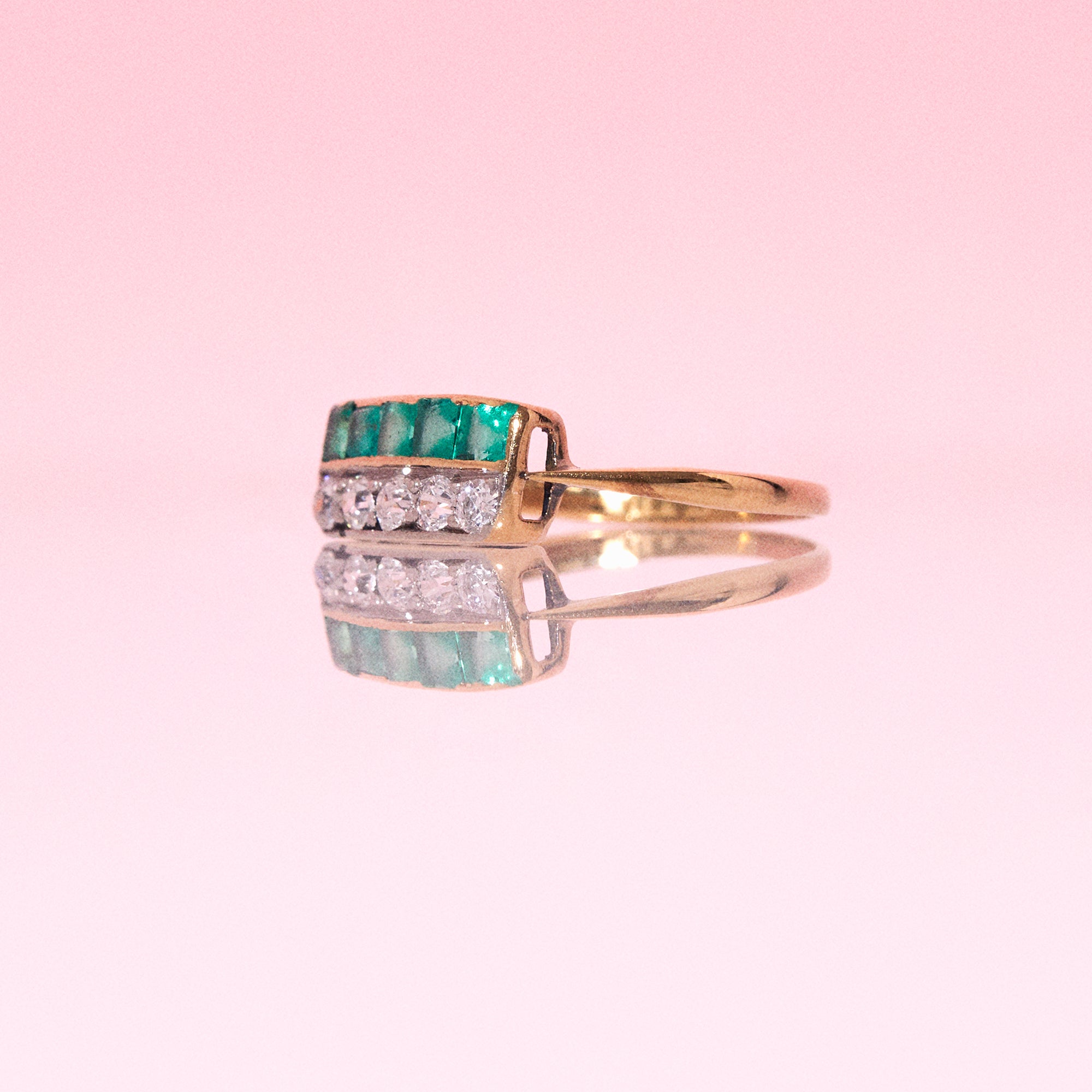 18ct gold ring set with emeralds and diamonds