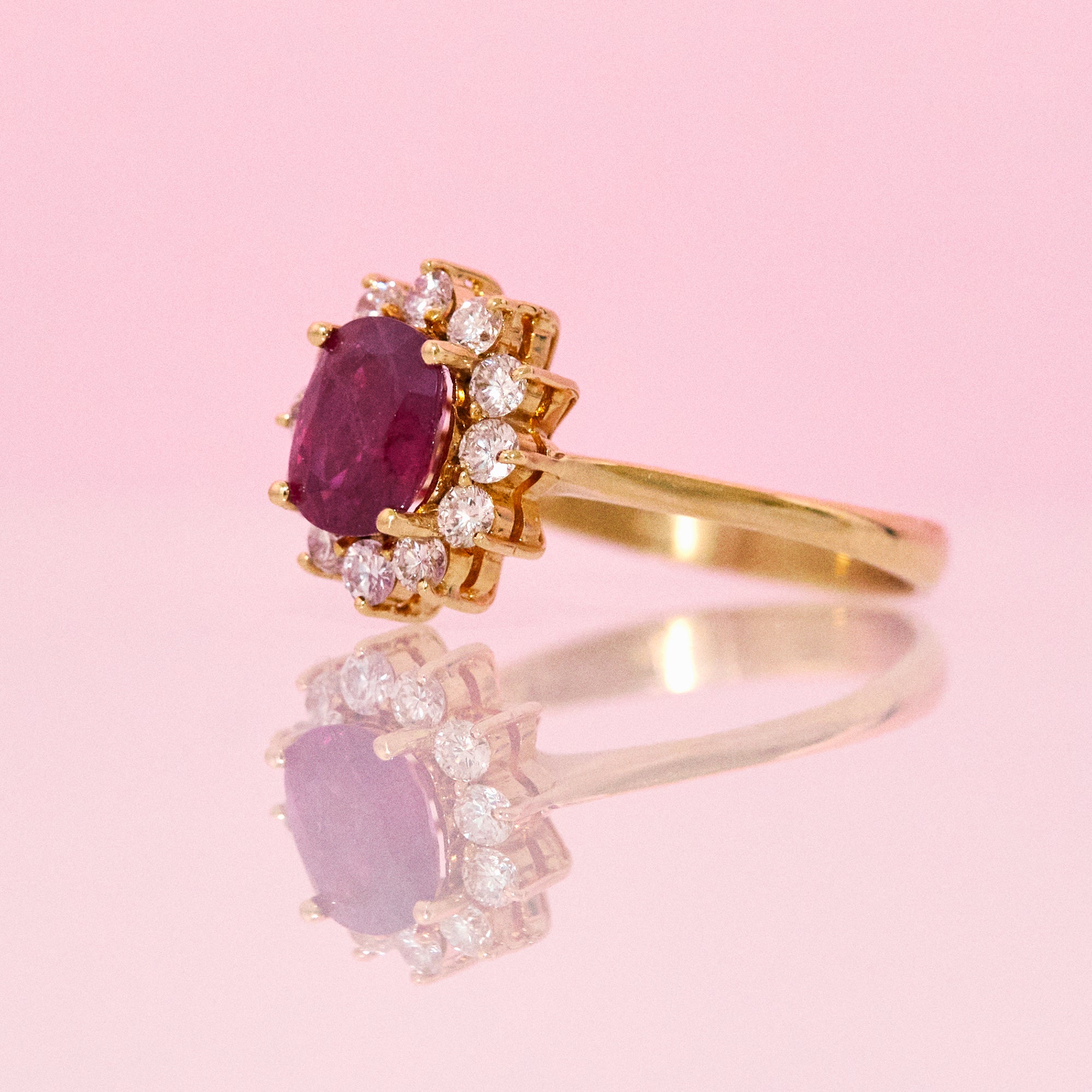 18ct gold ruby ring with a diamond cluster