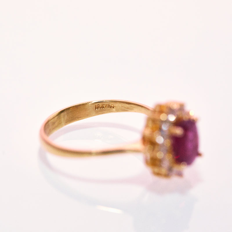 18ct gold ruby ring with a diamond cluster