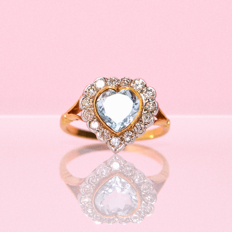 18ct gold ring set with a heart shaped aquamarine and diamonds