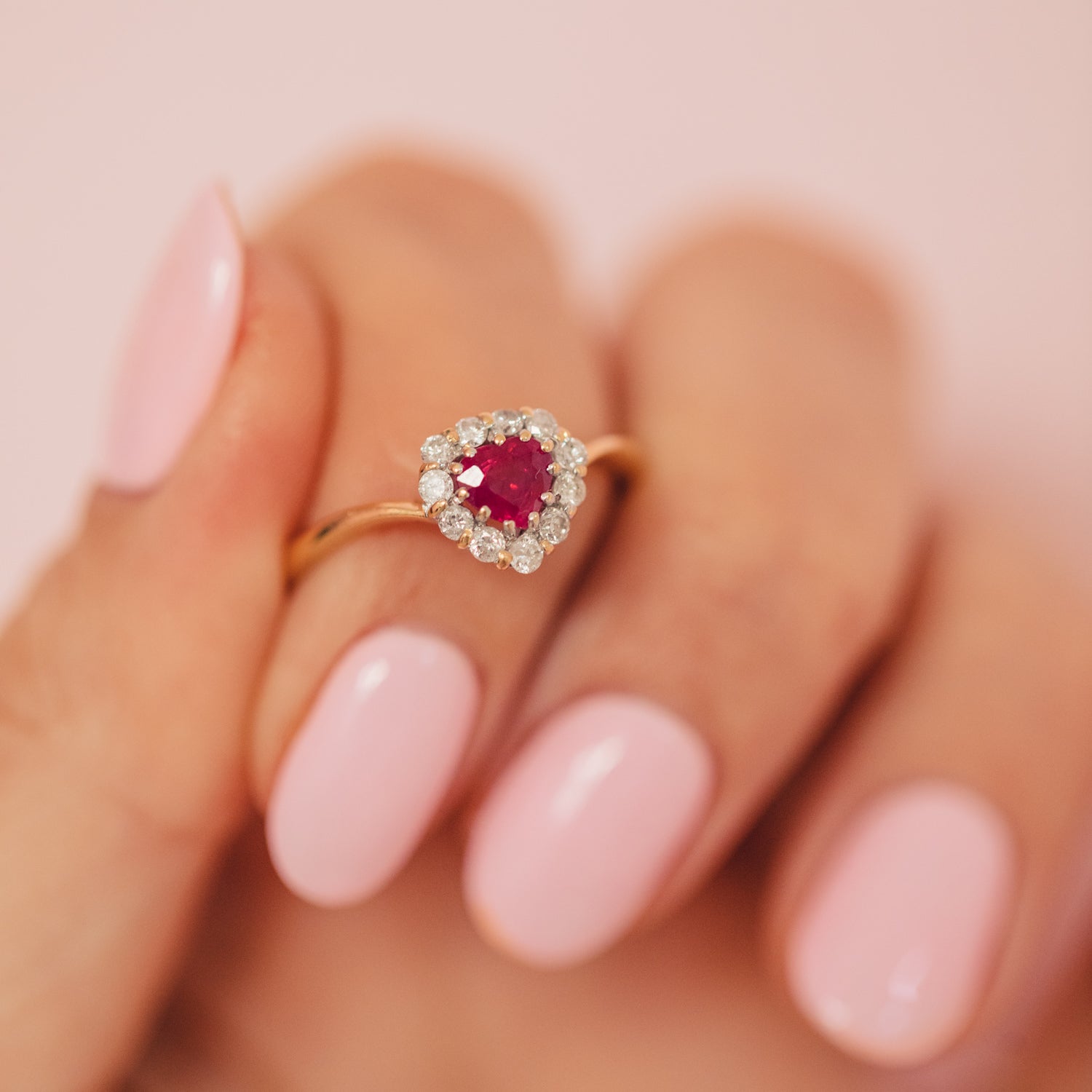 18ct gold ring set with a heart shaped ruby and diamonds