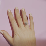 18ct yellow gold yellow diamond ring set with a diamond halo