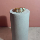 18ct gold ring set with three opals and four diamonds in a carved band