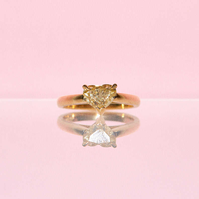 18ct gold ring set with a 1.23ct heart shaped yellow diamond