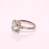 18ct white gold ring set with a diamond and a halo