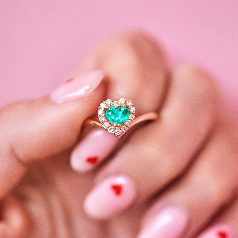 14ct gold ring set with a heart shaped emerald and diamonds