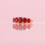 18ct gold carved ring with five garnets and diamonds