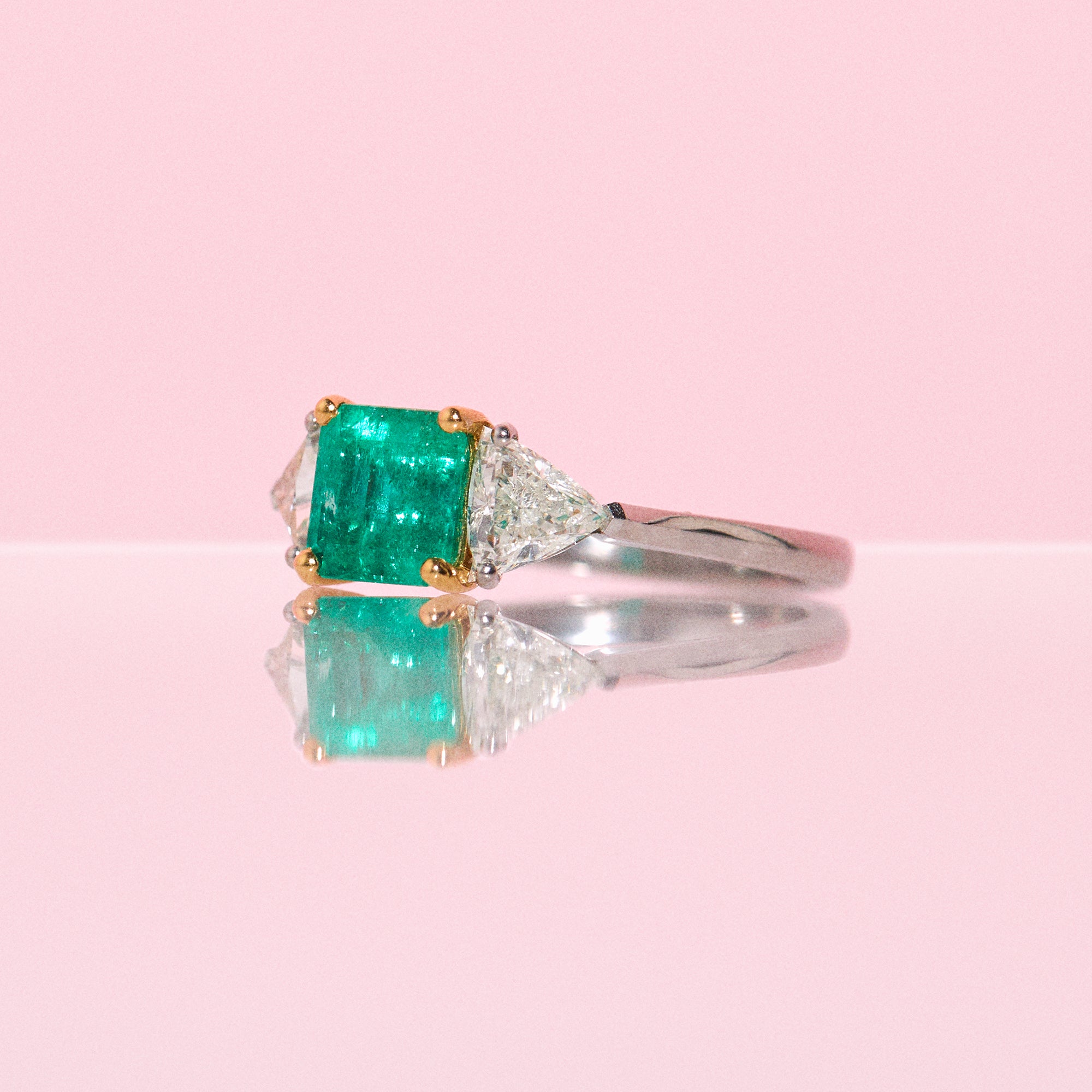 Platinum emerald and diamond three stone ring