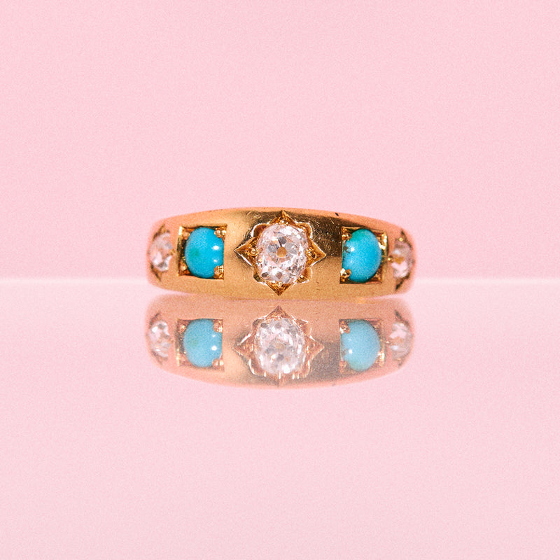 18ct gold ring set with diamonds and turquoise stones