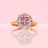 18ct gold ring set with a pink sapphire and diamonds