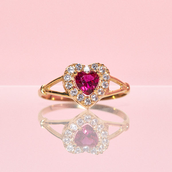 10ct gold ring set with a ruby and cubic zirconia