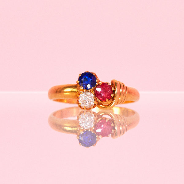 18ct gold ring set with a ruby, sapphire, diamond