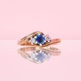 9ct gold three stone ring set with a sapphire and diamonds