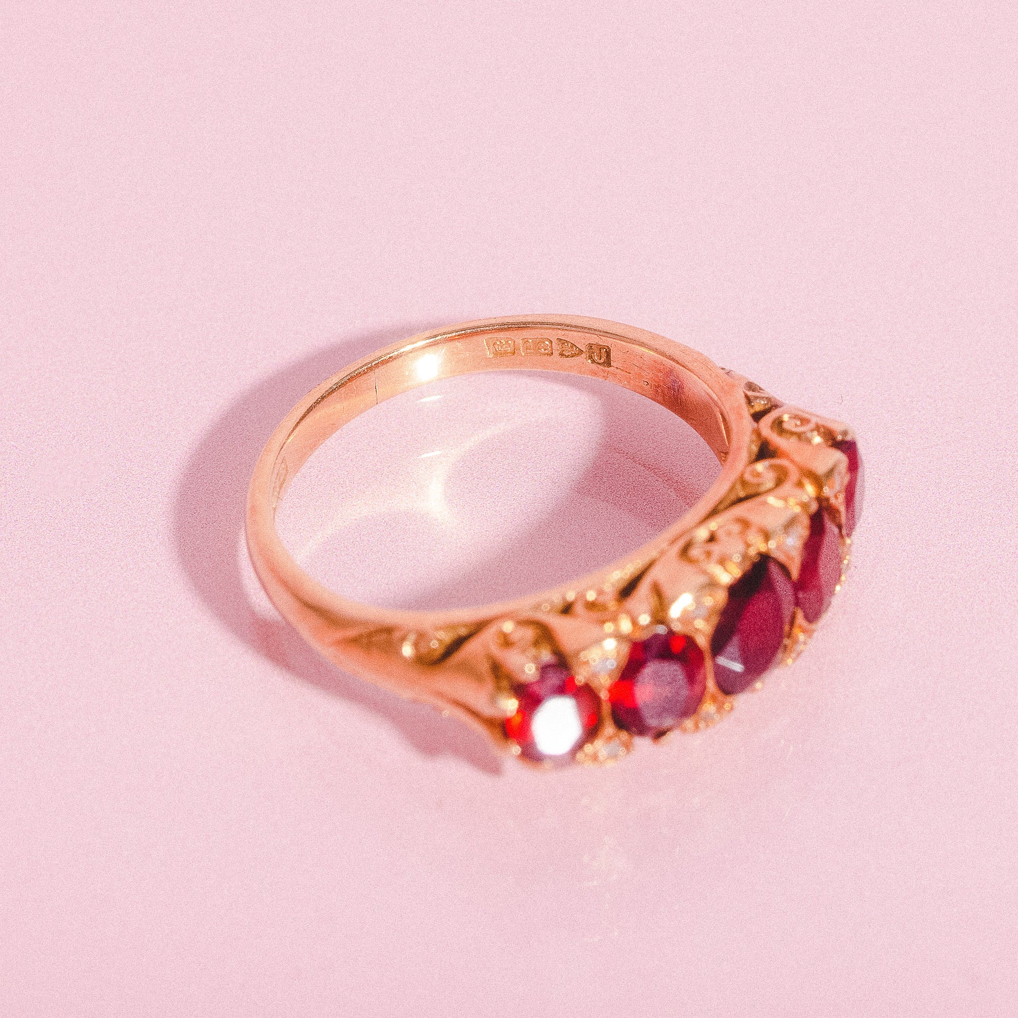 18ct gold carved ring with five garnets and diamonds