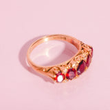 18ct gold carved ring with five garnets and diamonds