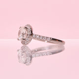 Platinum ring with a central diamond and a diamond halo
