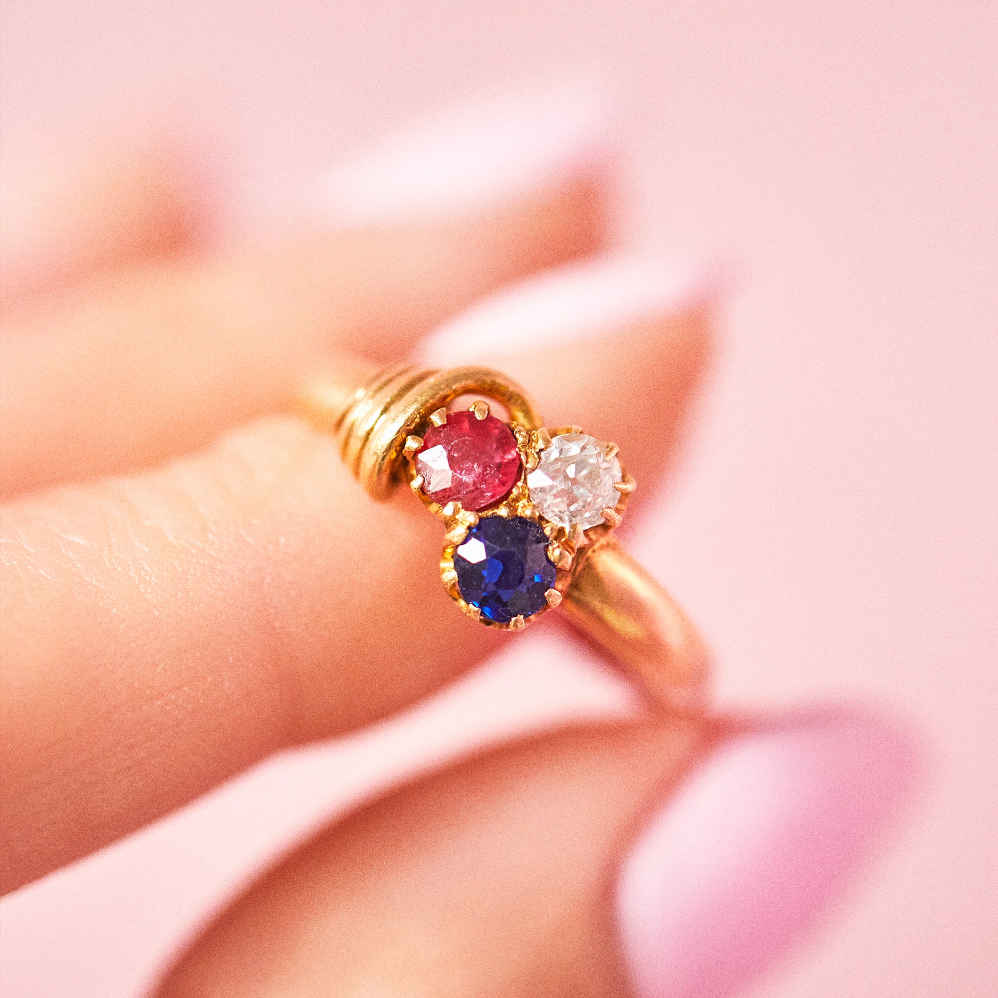 18ct gold ring set with a ruby, sapphire, diamond