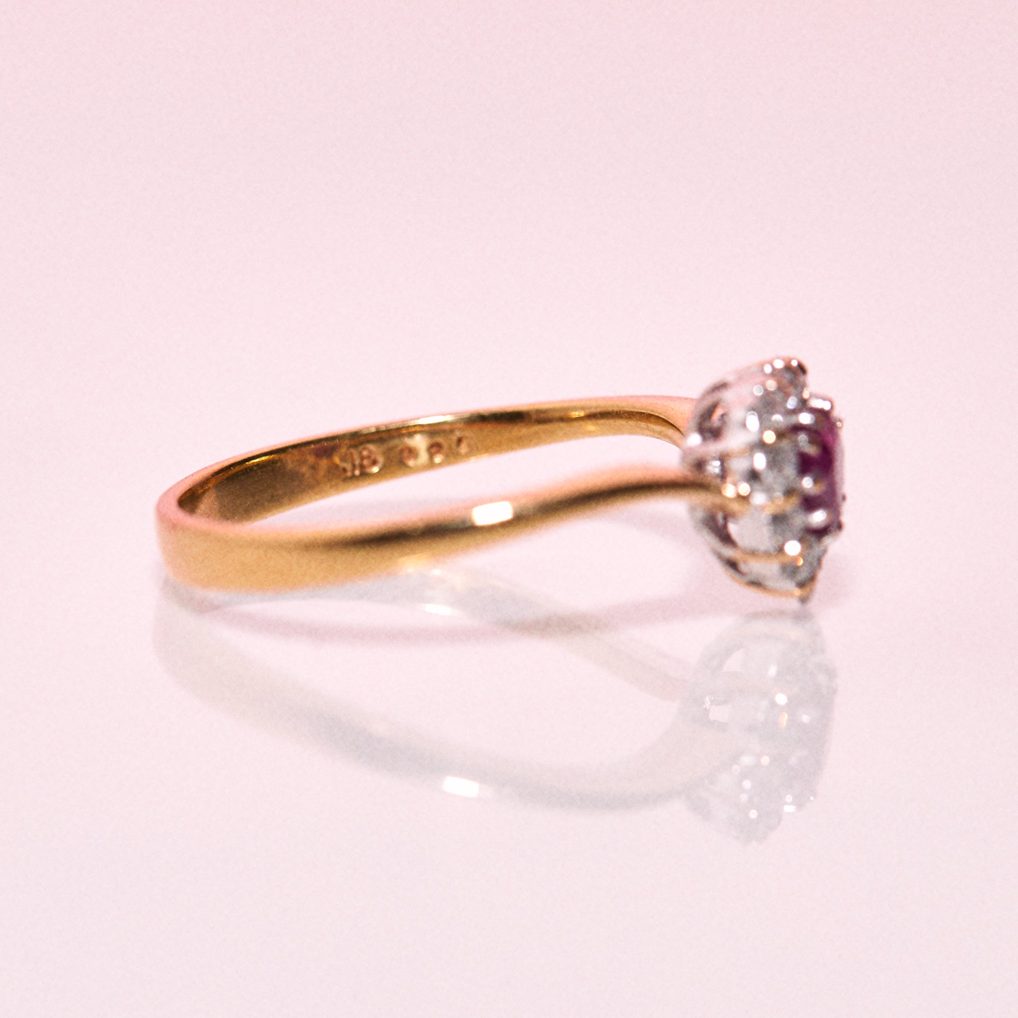 18ct gold ring set with a heart shaped ruby and diamonds