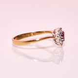 18ct gold ring set with a heart shaped ruby and diamonds