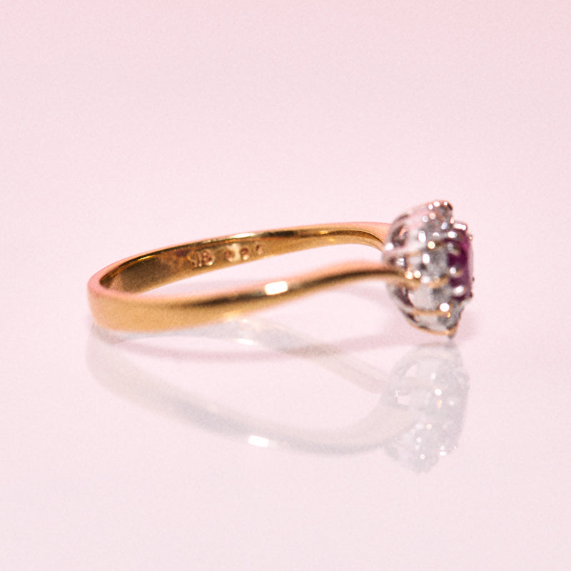 18ct gold ring set with a heart shaped ruby and diamonds