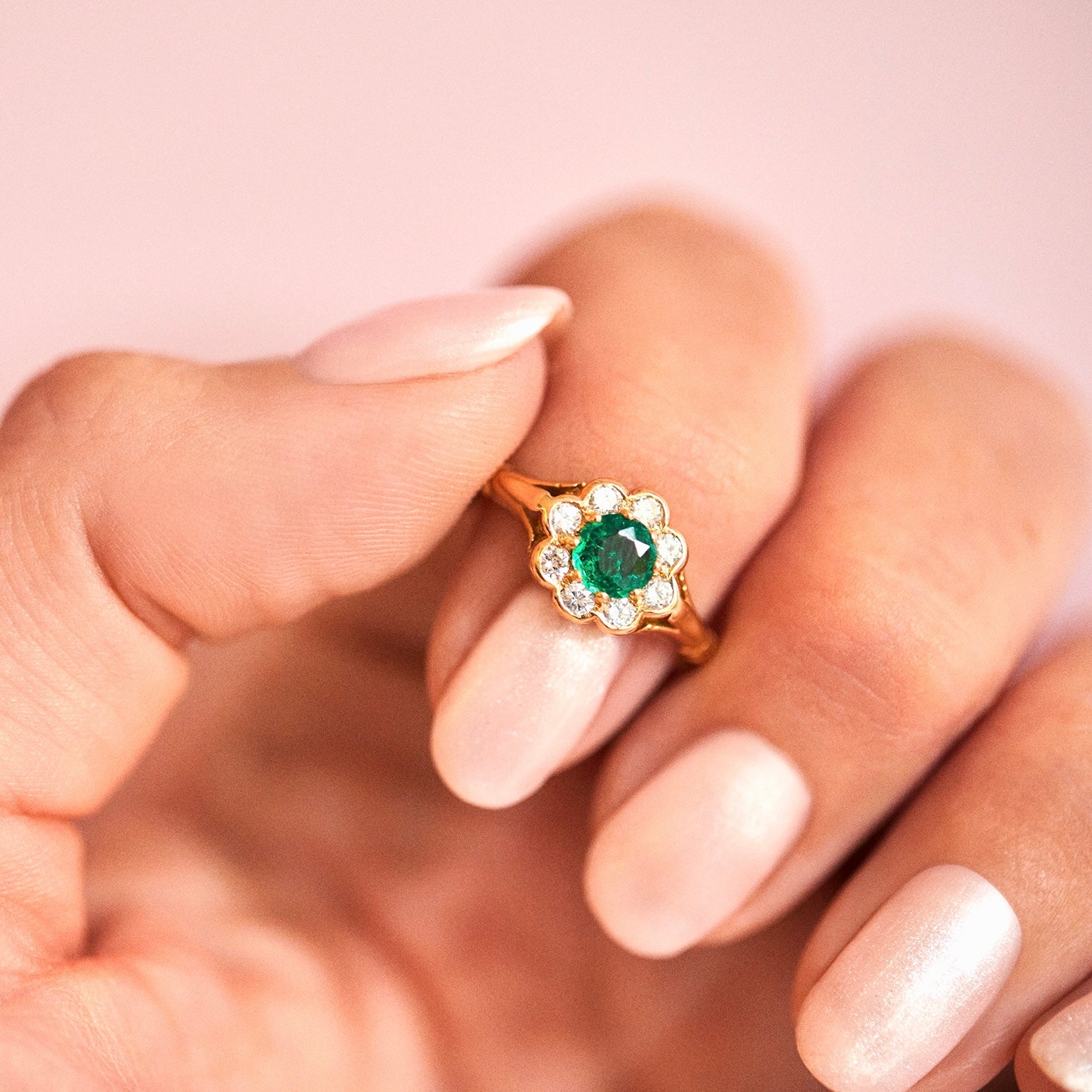 18ct gold ring set with an emerald and diamonds