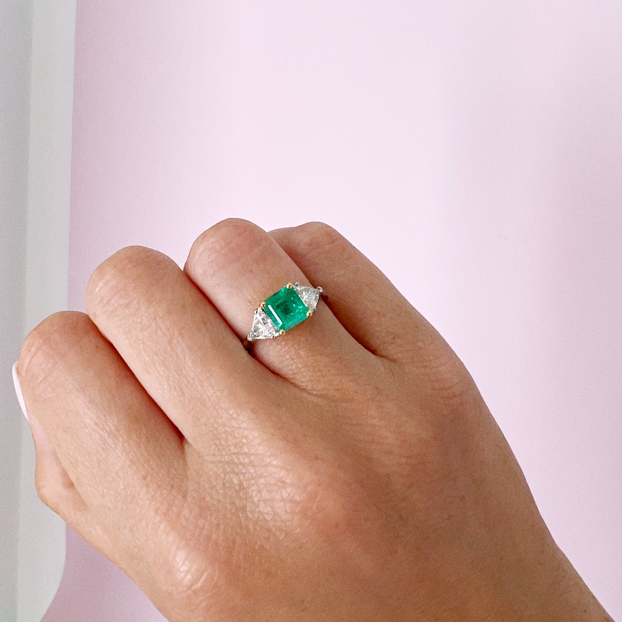 Platinum emerald and diamond three stone ring