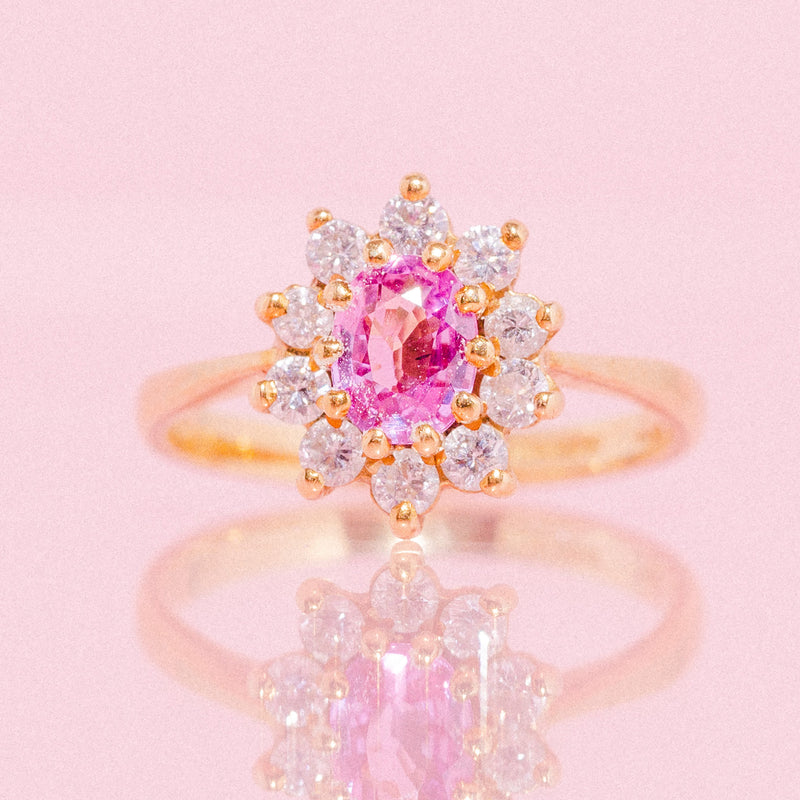 18ct gold ring set with a pink sapphire and diamonds