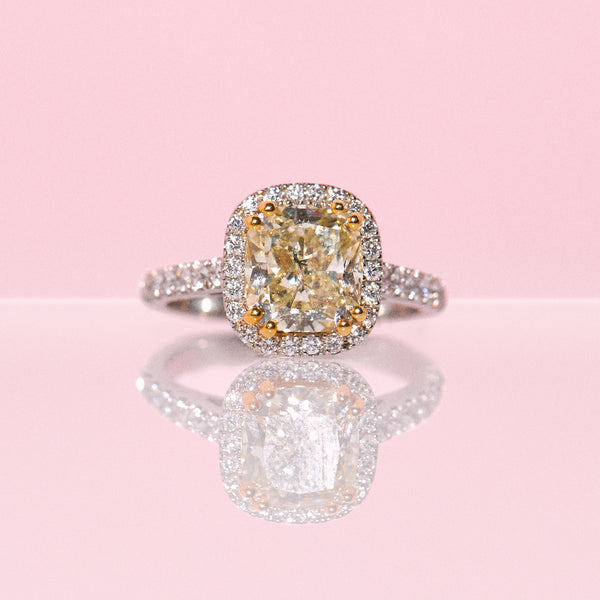 Platinum ring set with a 3ct yellow diamond and a diamond halo